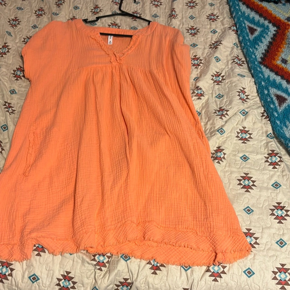 It’s is a pretty peach color it is very comfortable